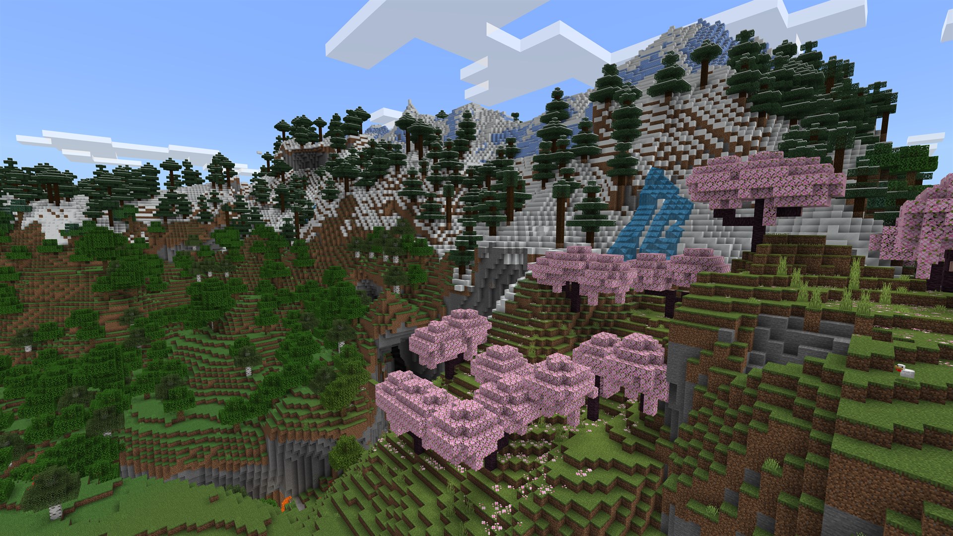 Cherry grove biome beneath snowy mountains in Minecraft — biome exploration on a free Minecraft server